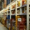 red and white labeled cans on shelf